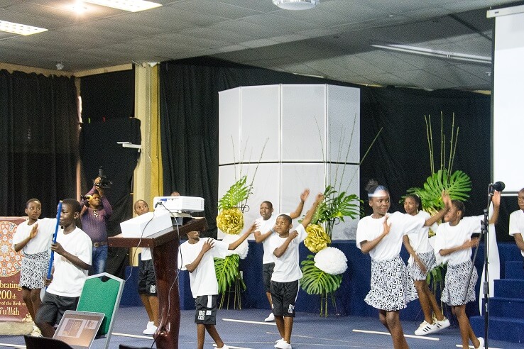 Polokwane - The main bicentenary celebration in Polokwane took place on Saturday 21 st October at 4pm
at Cosmo Leisure Lodge Hall. The main hall was filled with approximately 300 adults and youth and the
tens of children. The programme included friends from all over the province who performed traditional
dance, Jembe drums, and drum majorettes. There was also a beautiful choir presentation and prayers in
five languages. The film, “Light to the World” was also viewed. Bahá’í friends and their families from the
surrounding clusters of Thulamela, Mokopane,Bela Bela, Matox and Tzaneen attended the celebration.
Two members of the press representing the local newspaper were also present. The whole atmosphere
of the celebration reverberated with a sense of the beautiful vision of joy and unity.